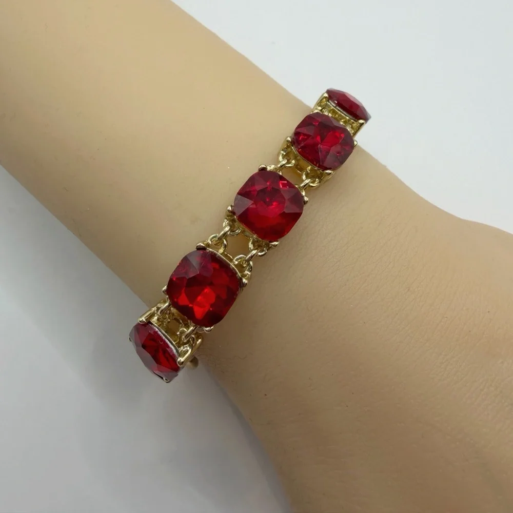 Cosmopolitan Gold Tone Red Crystal Bracelet | Cushion Cut Toggle Clasp